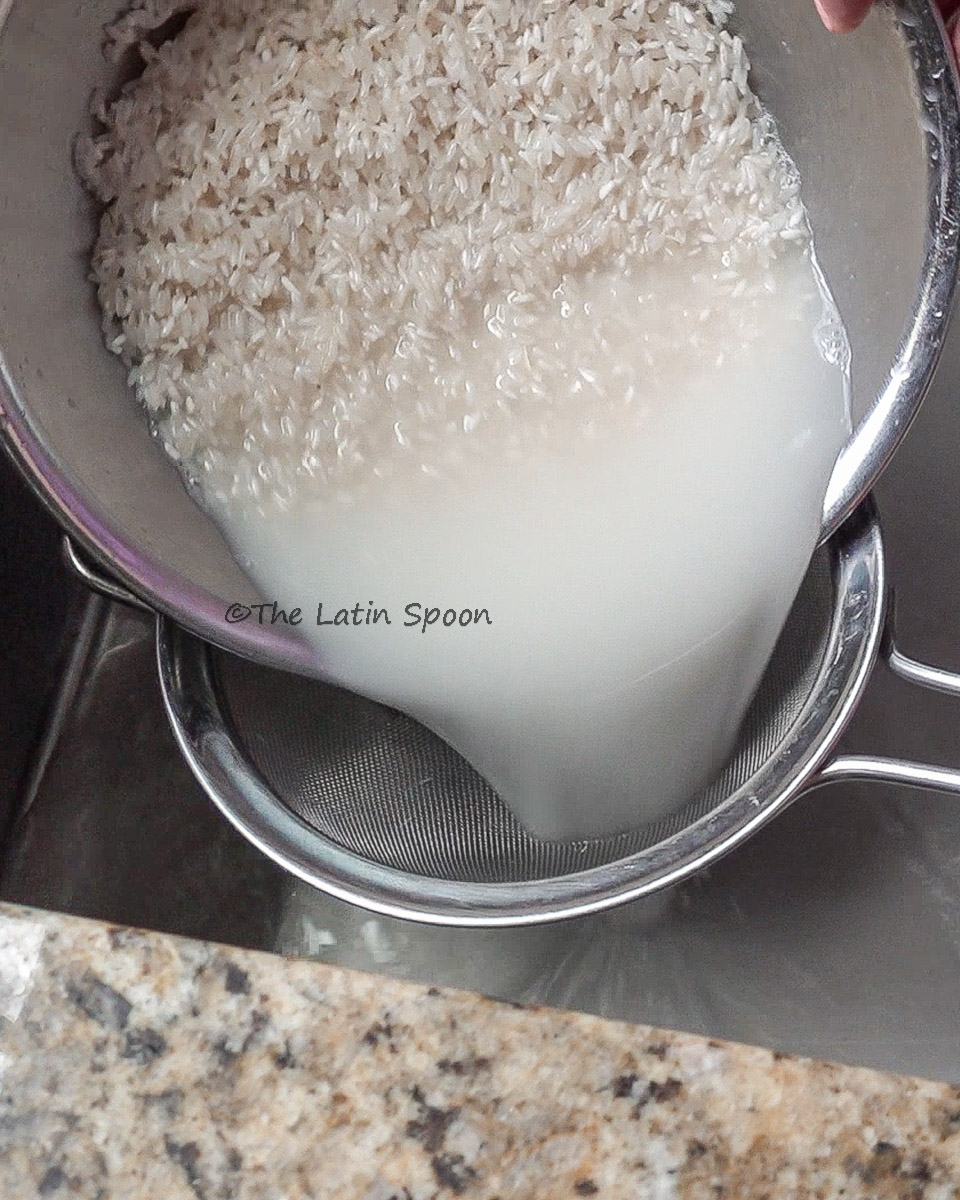 Separating water from rice through a sifter after rinsing to remove starches