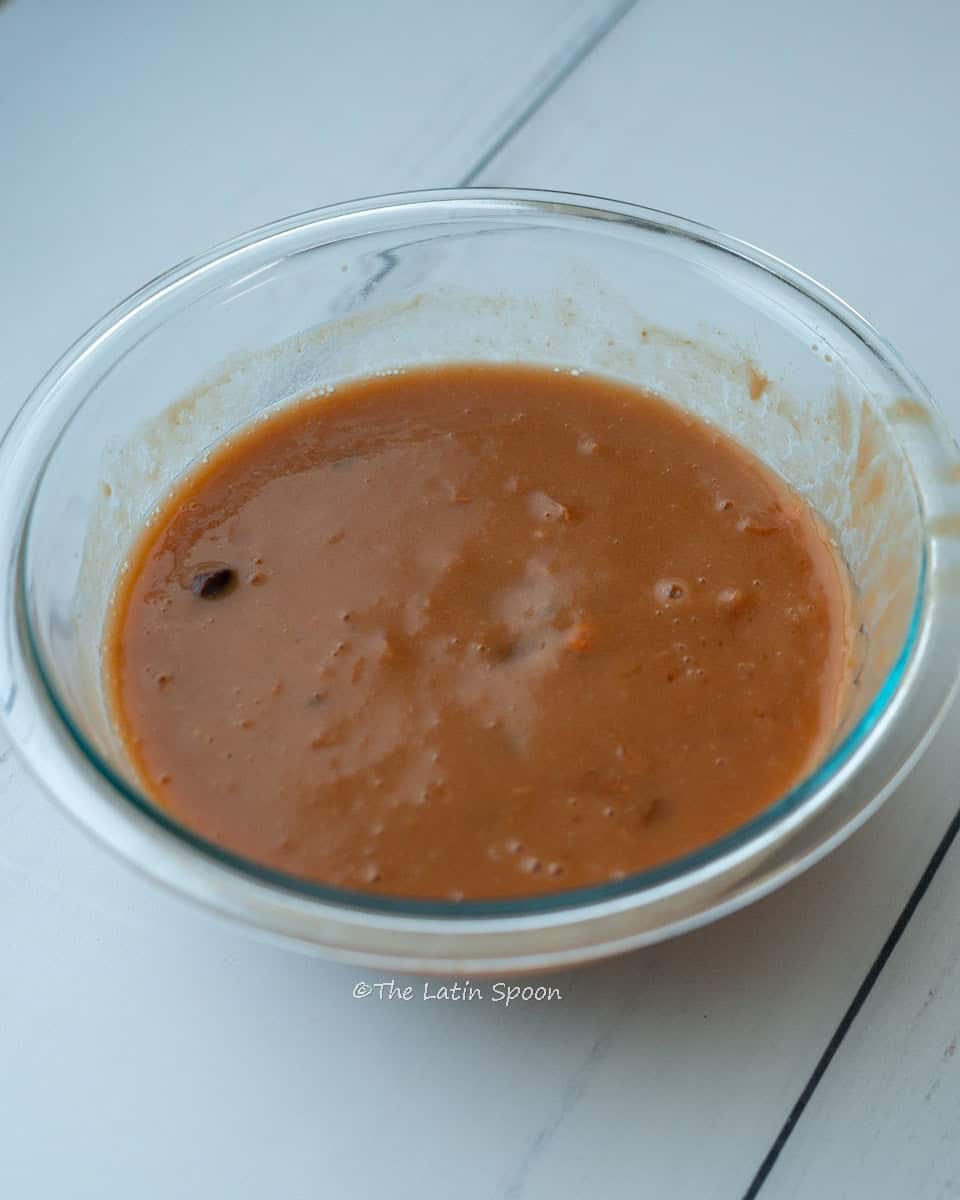A bowl showing the tamarind pulp mixture after adding water anda massage.