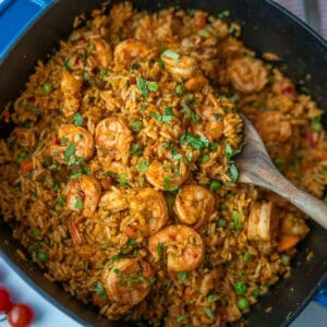 Blue pot filled with arroz con camarones, viewed from above.