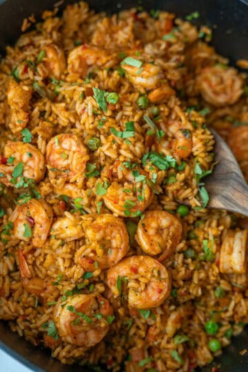 Blue pot filled with arroz con camarones, viewed from above.